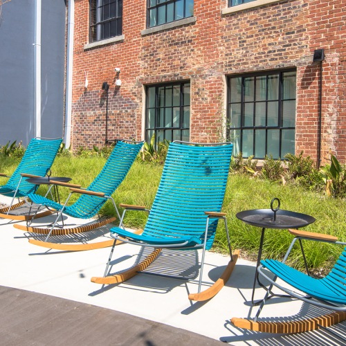 blue chairs in a sunny deck area