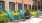 a set of blue lounging chairs on a patio